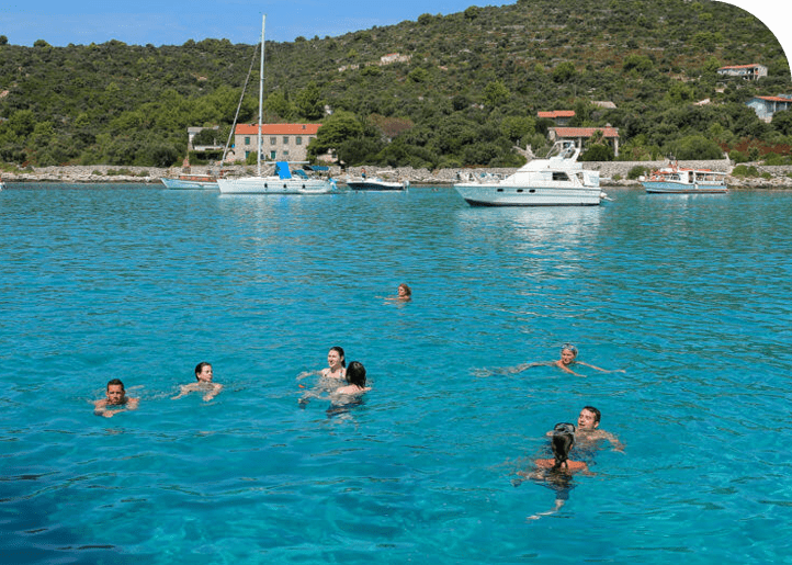 People swimming on the Split island Drvenik veli