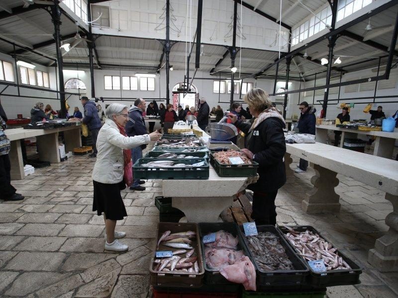 People buying fish at the fish market in Split Croatia