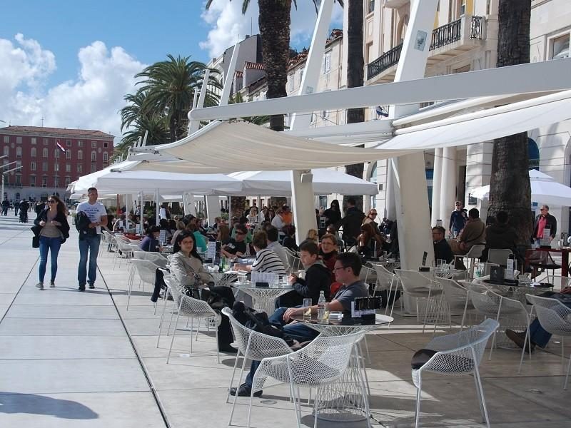 People drinking coffee on Riva promenade